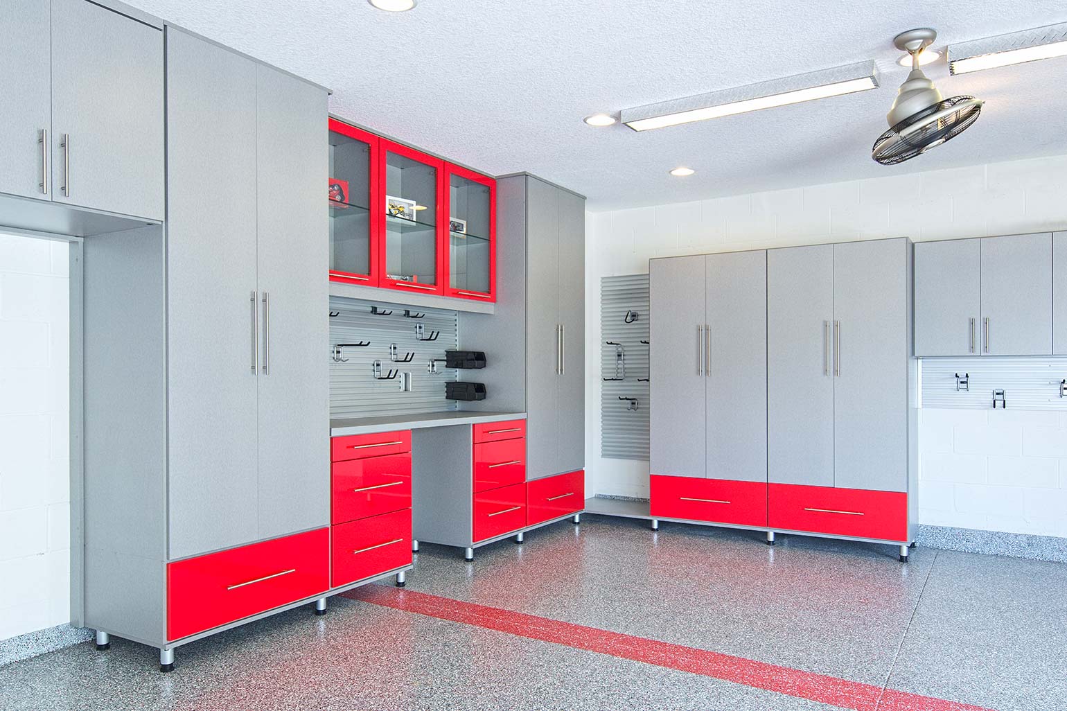 Garage cabinets with shelves and drawers.