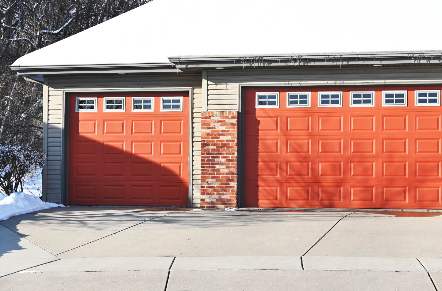 Garage with bright red garage doors.