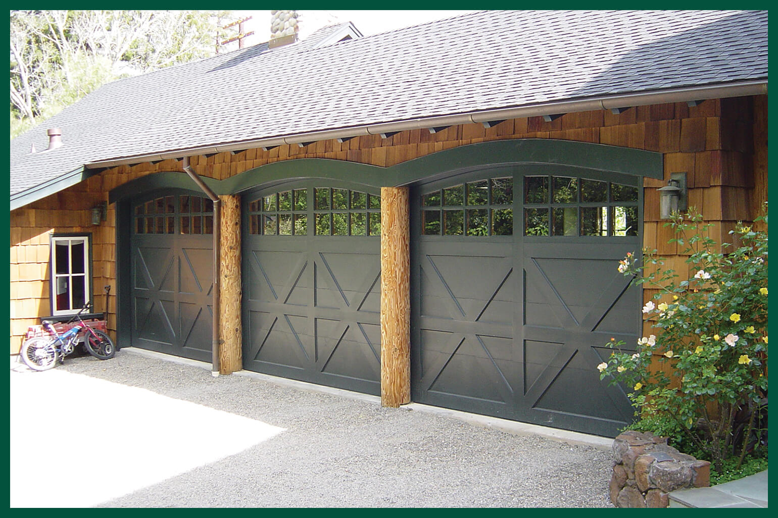 Small craftsman-style home with carriage garage doors