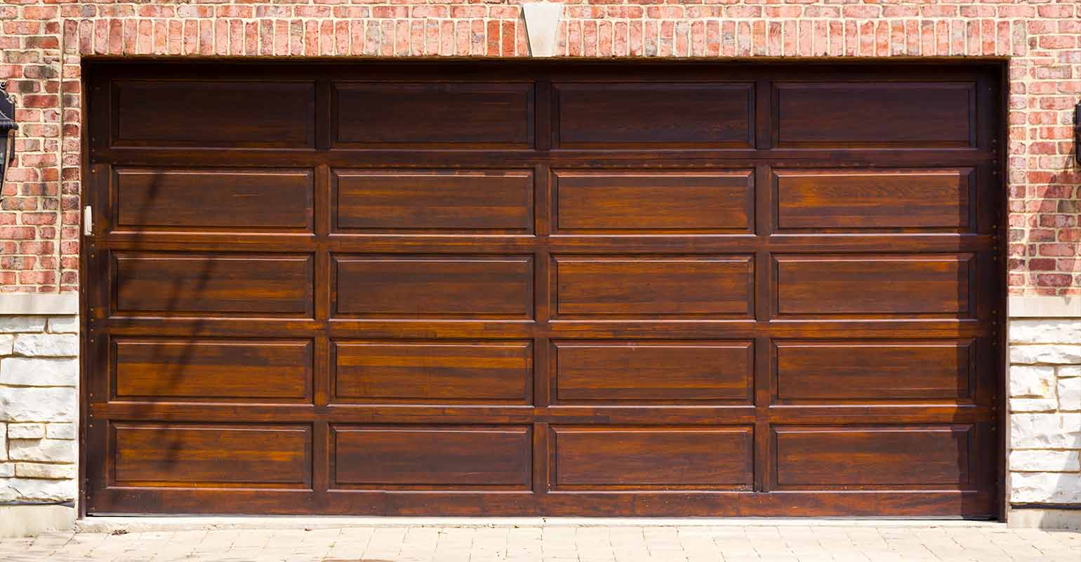 Dark faux wood garage doors.