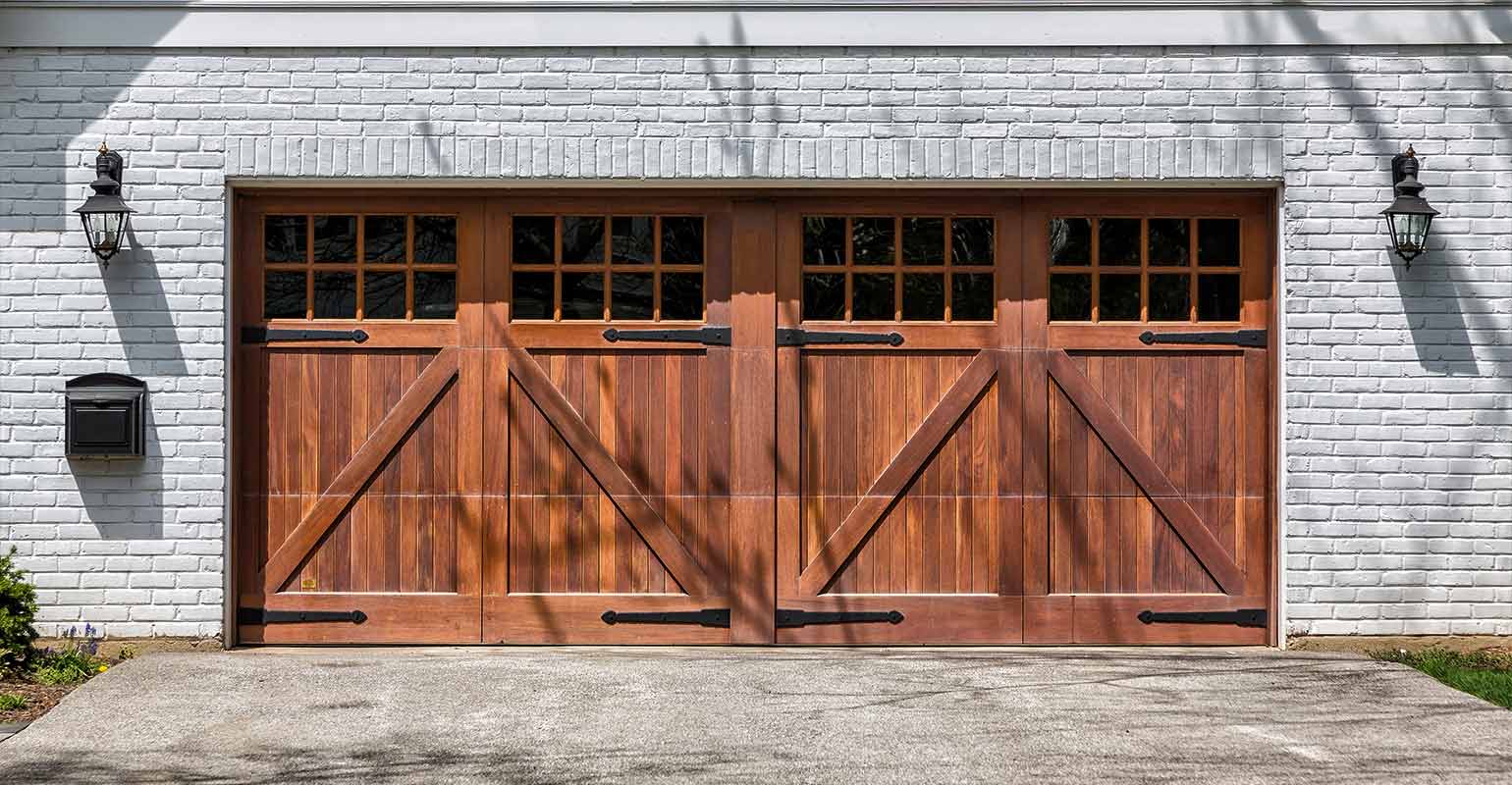 Farmhouse faux wood garage doors.