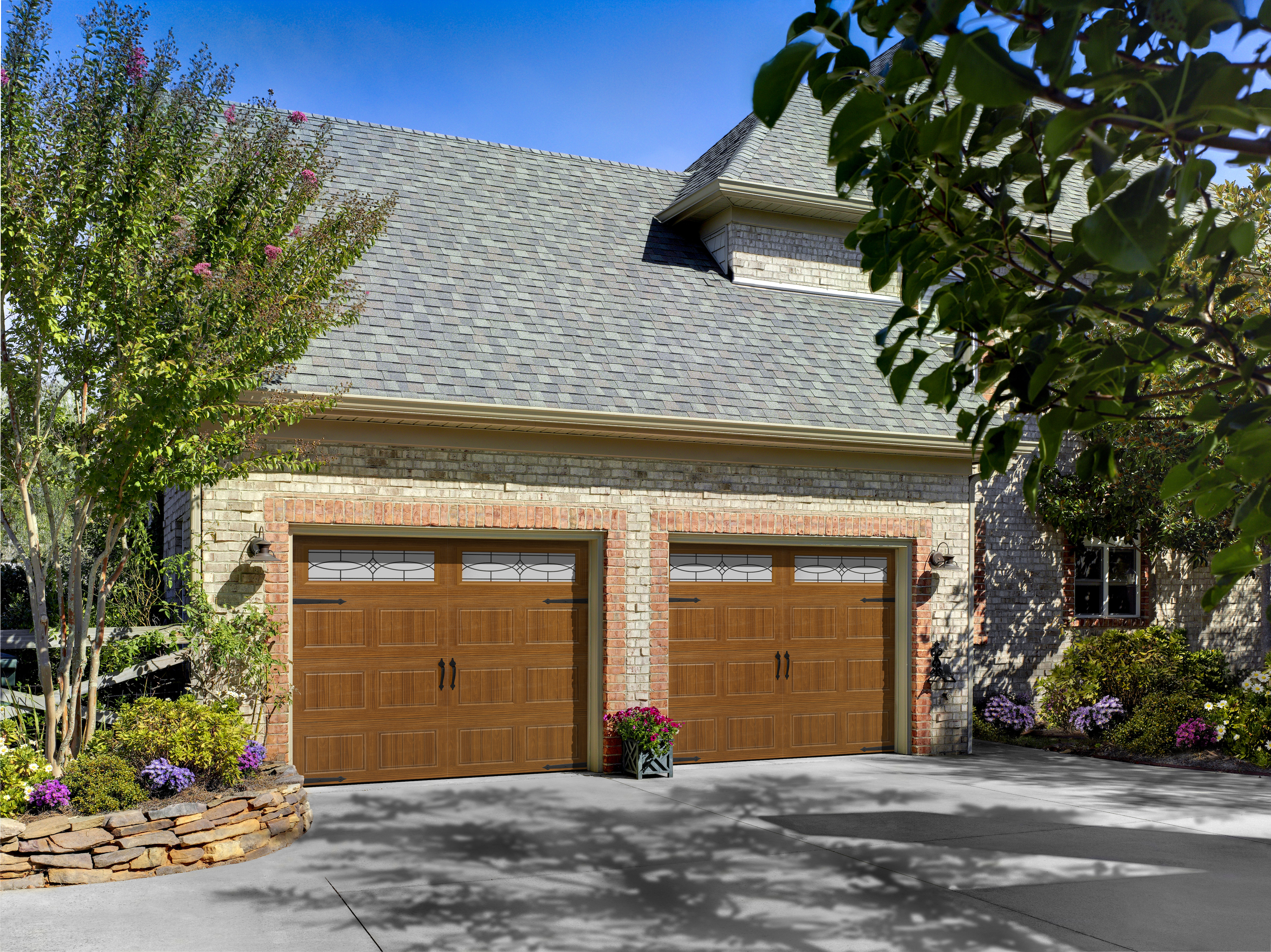 A simple garage with doors that look like wood.