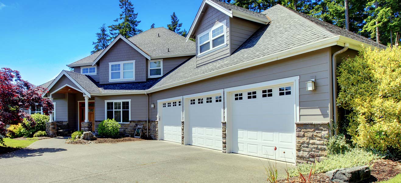 Traditional garage door installed by Precision Garage Door Service.