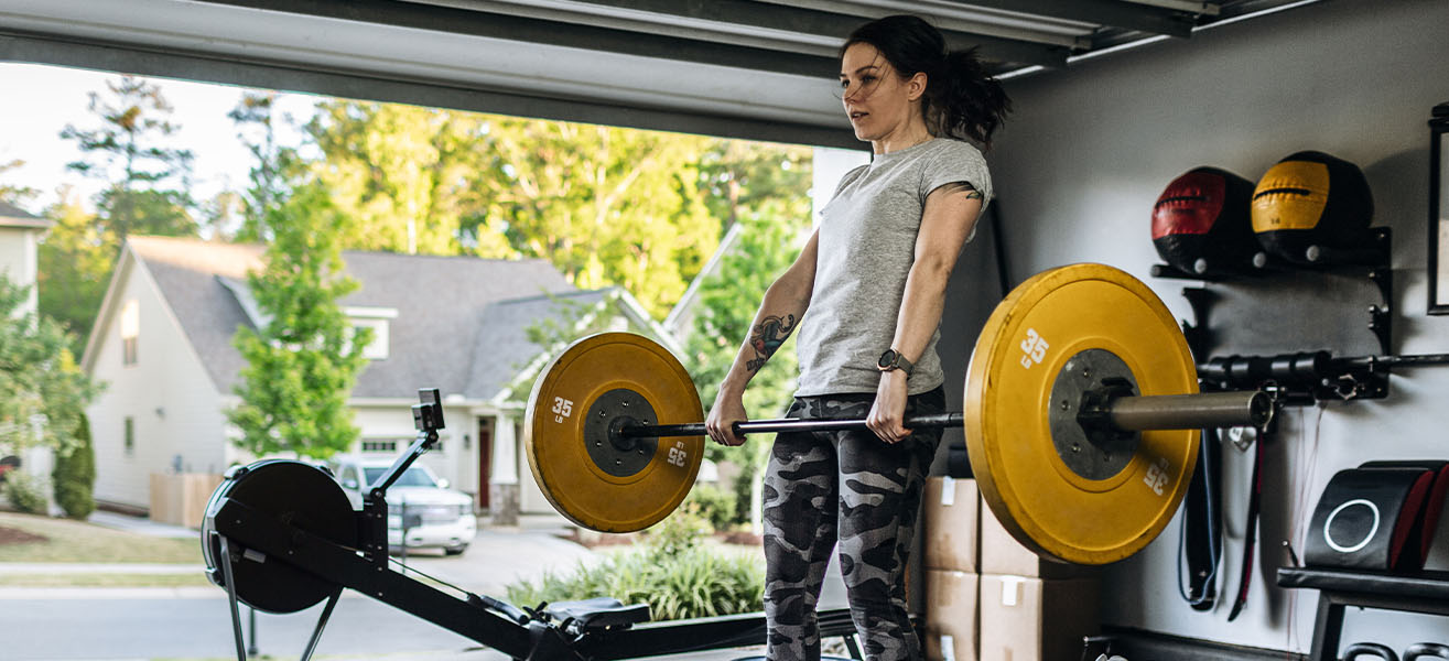 A person working out in their garage home gym