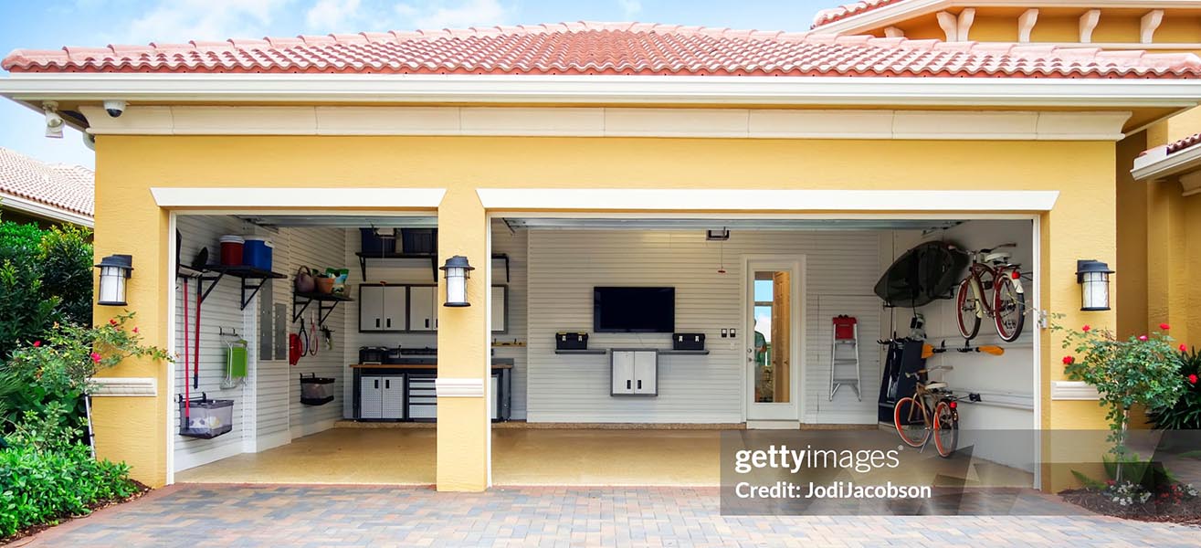 A remodeled garage with new fixtures in a yellow house.