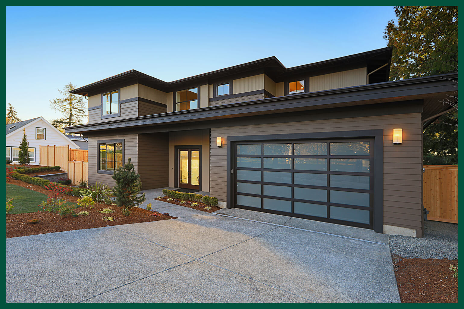 Modern home with glass garage door