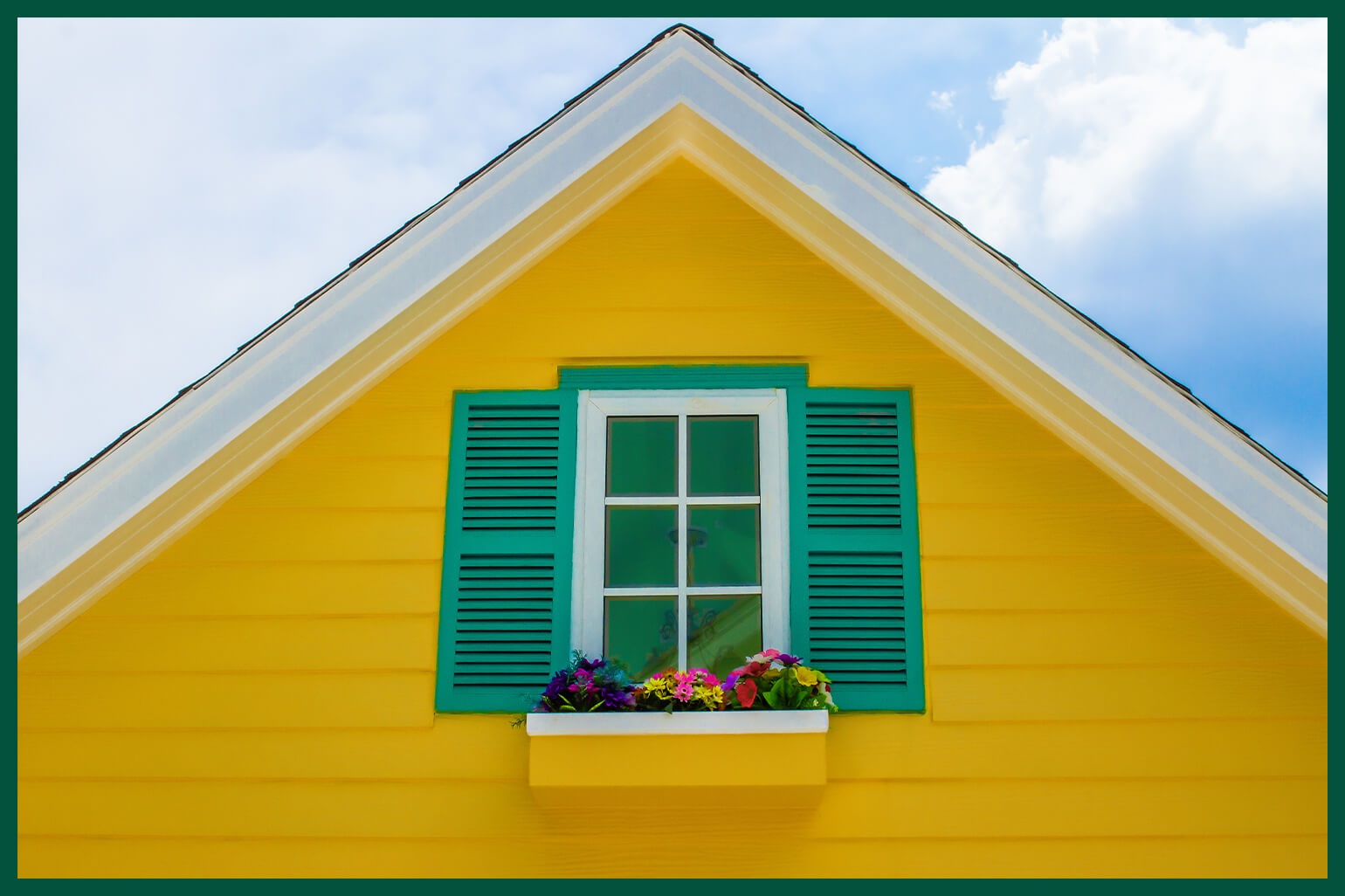 Small house with bold yellow shutters