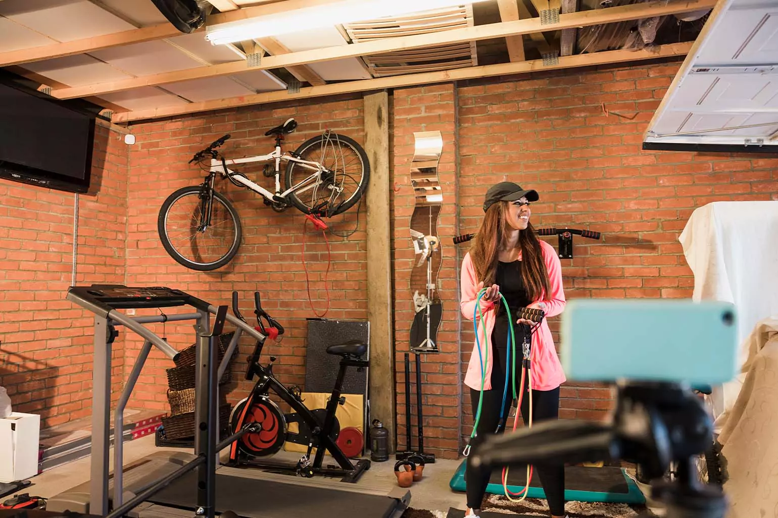 A person working out in a small garage gym.