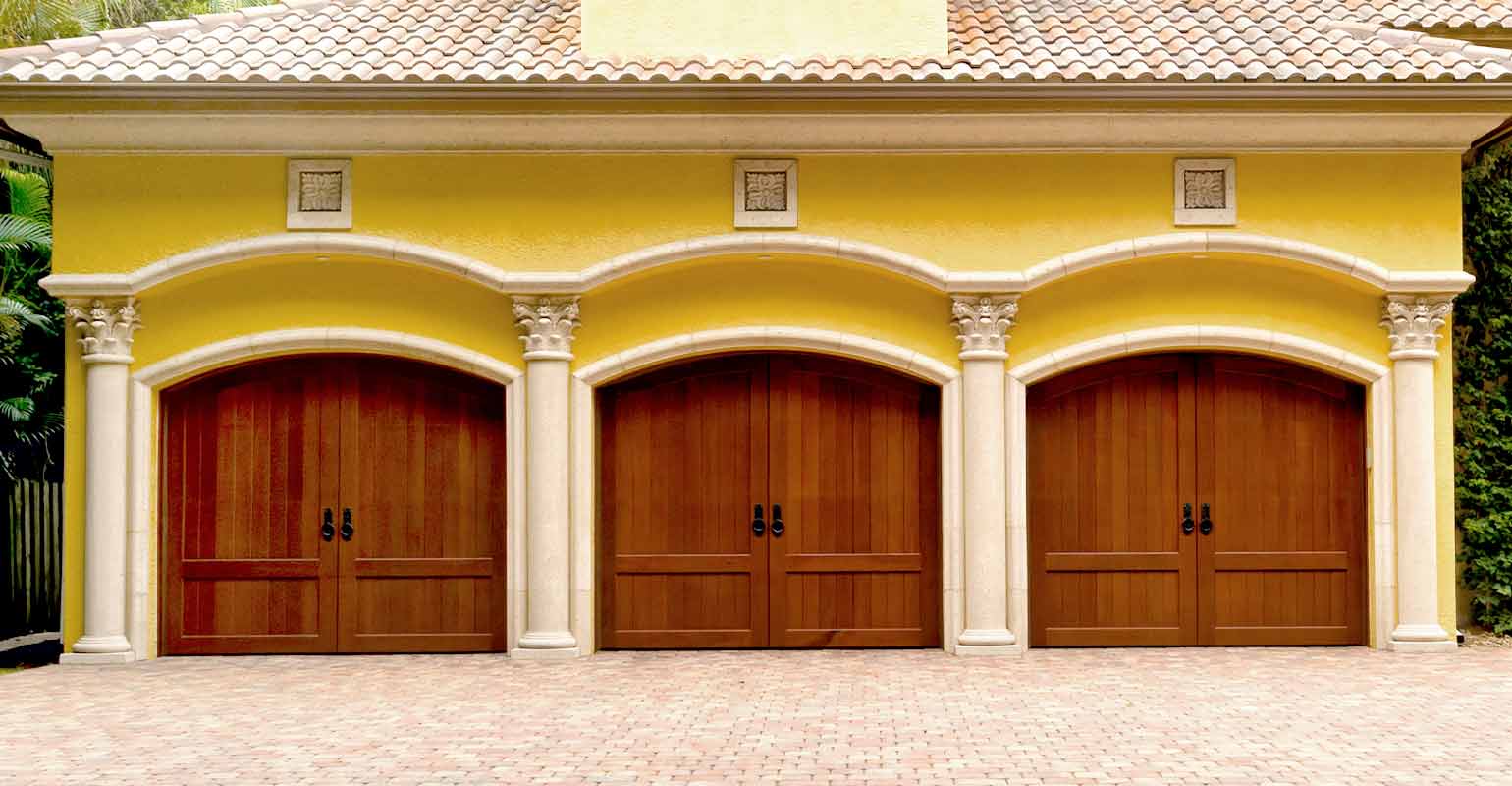 Traditional faux wood garage doors.