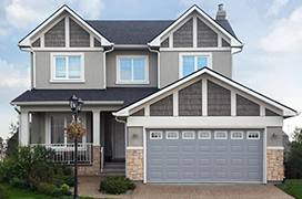 A house with a gray garage door.