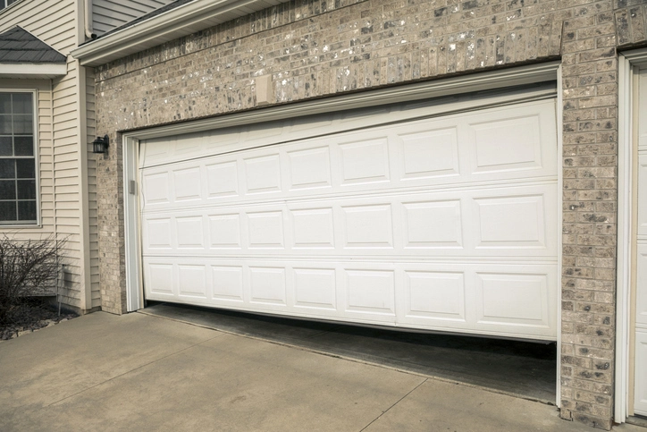 A Garage door is broken and not functional | Precision Garage Door Service of Chattanooga