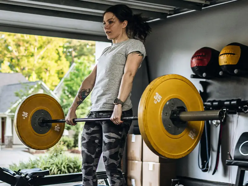 A person working out in their garage home gym