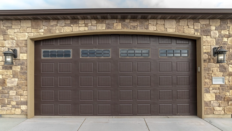 Large garage with double brown wooden door | Precision Garage Door Service of Chattanooga