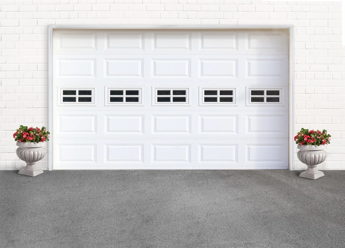 White garage door with flower plants on both sides | Precision Garage Door Service of Knoxville